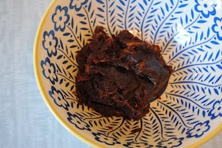 Bowl of chopped dates mixed with butter and cinnamon to fill a Kahk.