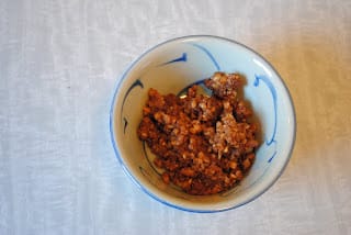 Bowl of rose water and crushed walnut filling for Kahk.