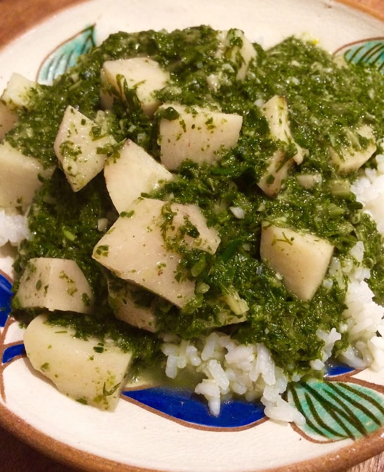 Chunks of cooked taro, minced fresh herbs and swiss chard with rice.